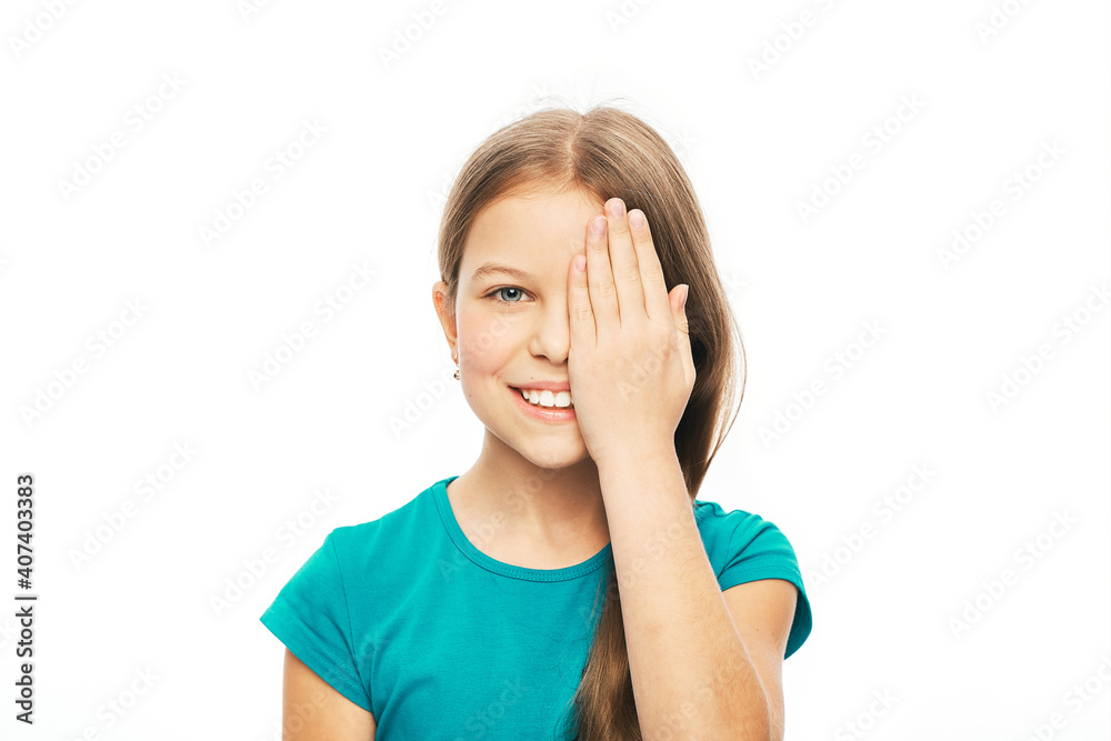Smiling child closing eye with her hand for checking vision, isolated on white background. Vision test concept for children Smiling child closing eye with her hand for checking vision, isolated on white background. Vision test concept for children