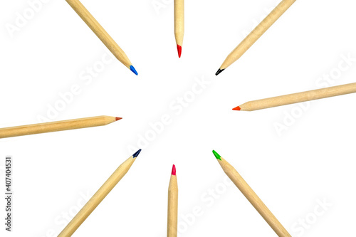 light wooden pencils with colored leads lie in a circle isolated on a white background. top view