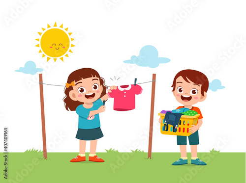 little kid helping to do chores and dry the clothes outside