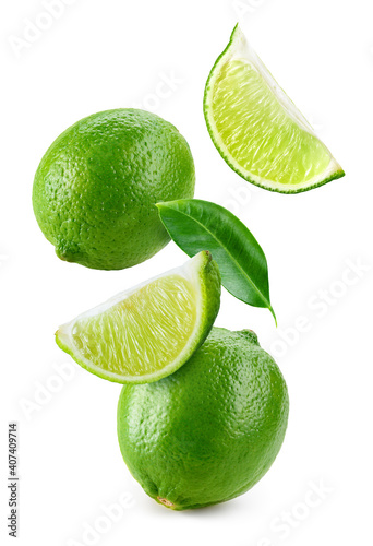 Lime fruit isolate. Lime whole, half, slice, leaf on white. Falling lime slices with leaves. Flying fruit. Full depth of field..