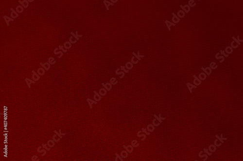 Red fabric background texture. Red cloth. Fabric surface for banner background. Rustic canvas fabric texture in red color. Fabric background for graphic design.