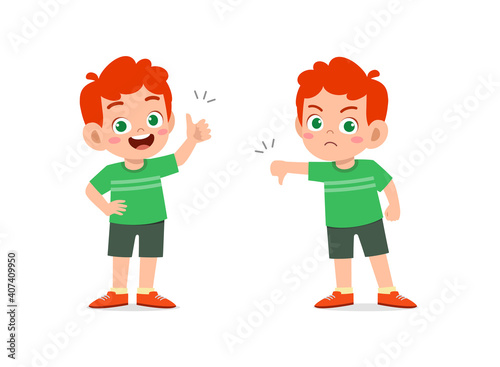 little boy show hand gesture thumb up and thumb down © Colorfuel Studio
