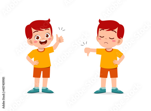 little boy show hand gesture thumb up and thumb down