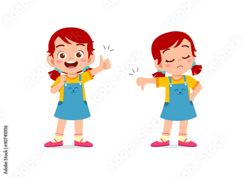 little girl show hand gesture thumb up and thumb down