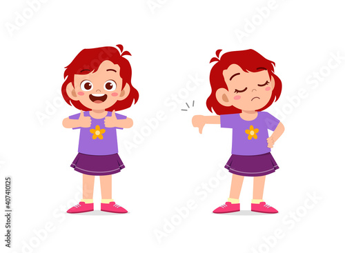 little girl show hand gesture thumb up and thumb down