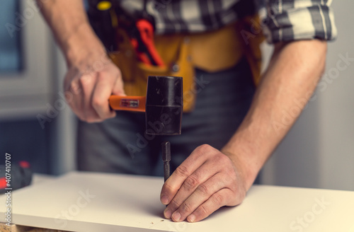 Man working during process of furniture manufacturing