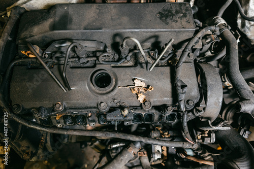 engine detail. Tank container for diesel in a car. Tank container in an accident car. Auto parts after accident © Marianna