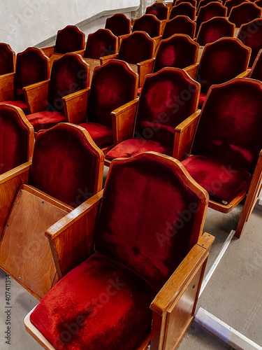 Empty theater hall before the concert. Rows of red seats in the theater