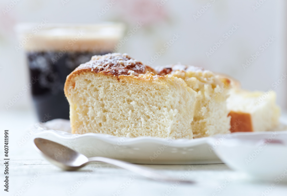 Simple yeast cake on bright background. Close up. Simple yeast cake on bright background. Close up.