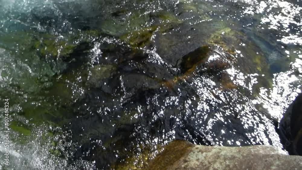 Whirlpool of mountain pure river Verzaska in Switzerland. Water wears away the stone. Wilderness nature. View of fast flowing waters of mountain pure river and vortex, pool funnel.