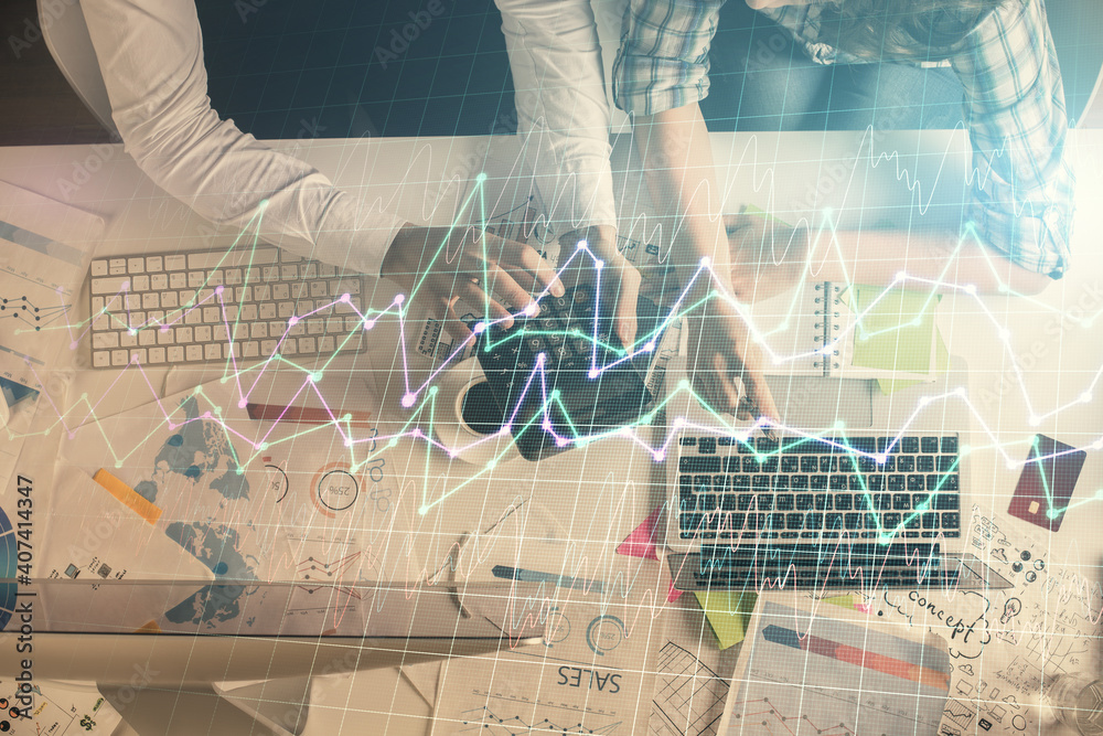 Double exposure of man and woman working together and financial graph hologram drawing. market analysis concept. Computer background. Top View. Double exposure of man and woman working together and financial graph hologram drawing. market analysis concept. Computer background. Top View.