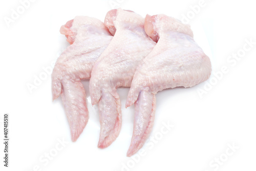 Raw Chicken wings isolated on white background. Three fresh chicken wings for cooking. Close-up. Top view.