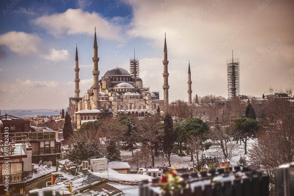 The Blue mosque in winter day cover with snow