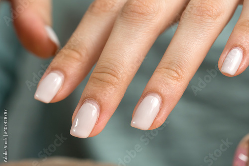 Manicure. Nude nail polish  classic. Overgrown nail polish. Manicure correction. An old manicure. Nail care. Beauty salon  SPA  procedure. Home nail care. Manicure tools. Beauty  lifestyle. 