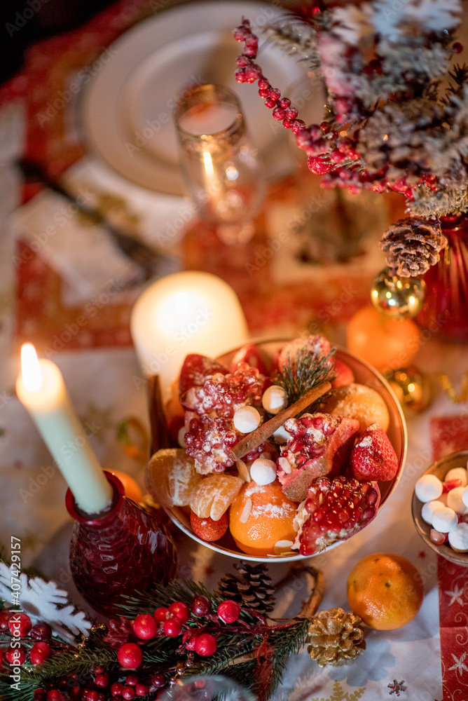 treats on the Christmas table with candles close-up