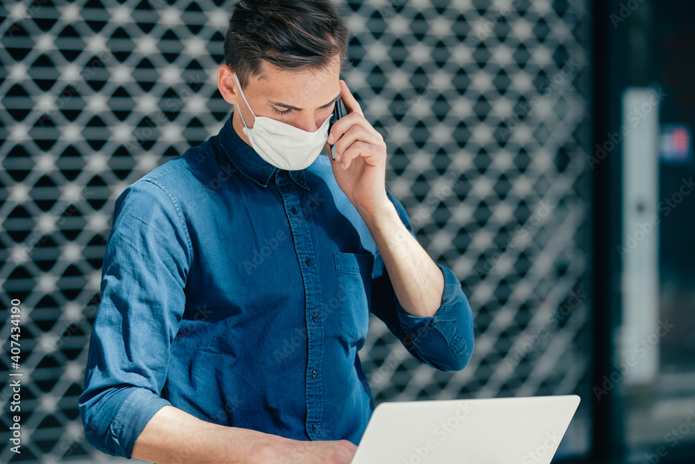 young man in a protective mask looking at the camera young man in a protective mask looking at the camera
