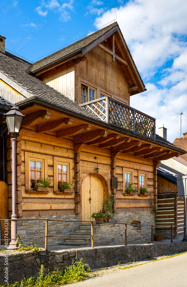 Traditional wooden houses in historic royal open-air museum town of Lanckorona in mountain region of Lesser Poland Traditional wooden houses in historic royal open-air museum town of Lanckorona in mountain region of Lesser Poland