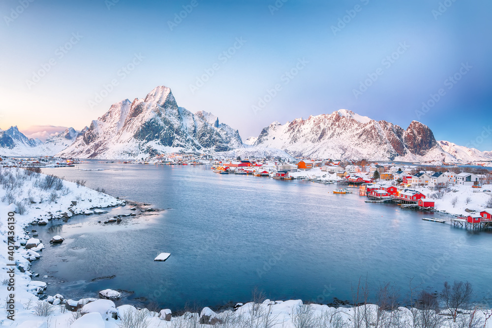 Dramatic evening cityscape of Reine town