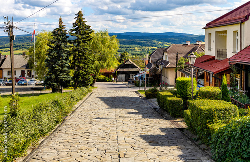 Fototapeta Naklejka Na Ścianę i Meble -  Panoramic view of central market square of historic royal open-air museum town of Lanckorona in mountain region of Lesser Poland
