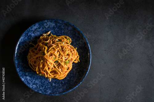 Single bowl spaghetti on a black stone table