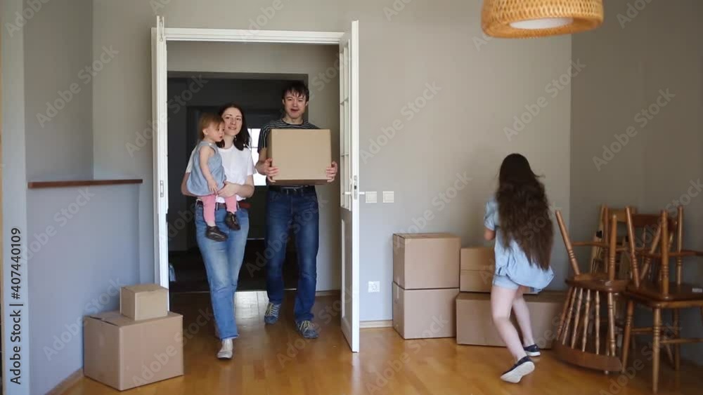 large family enters its new home. moving to apartment. boxes in house. large family enters its new home. moving to apartment. boxes in house.