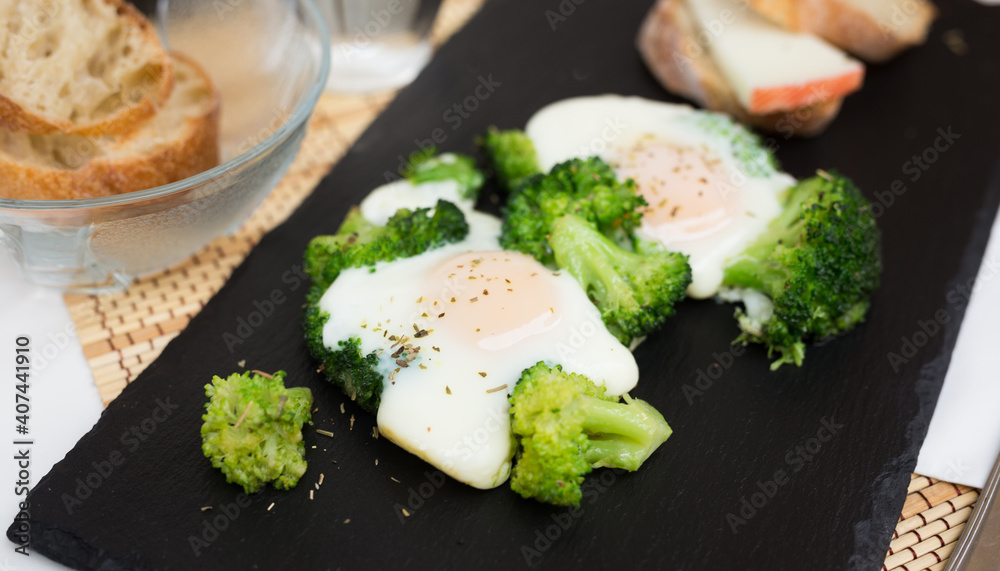 breakfast of crumpled eggs with broccoli