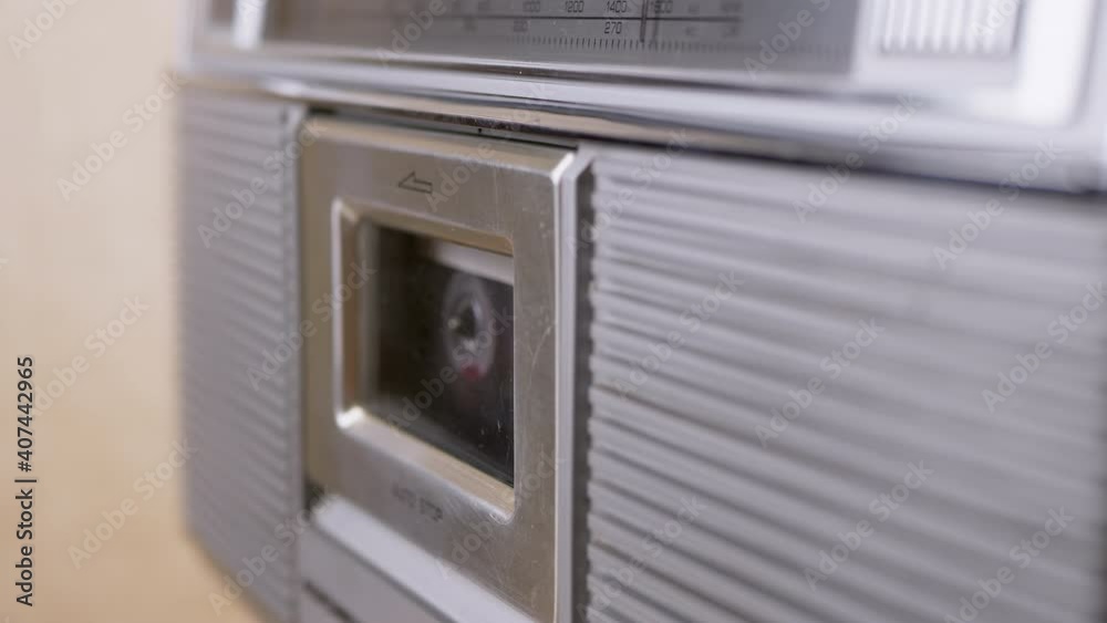 Female Finger Closes Cover Of Cassette Recorder With Old Cassette Inside. 4K Female Finger Closes Cover Of Cassette Recorder With Old Cassette Inside. 4K