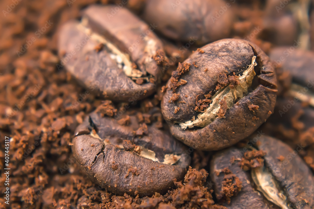 Close-up of coffee beans, freshly roasted coffee grains lie on a heap of ground coffee