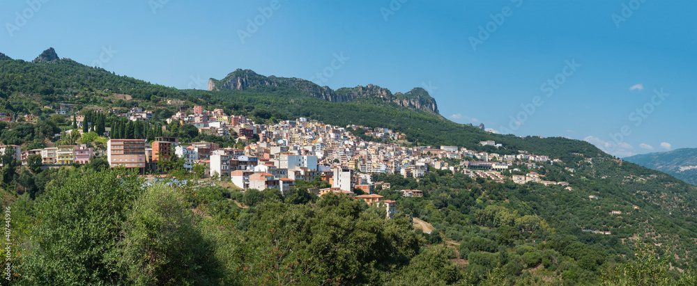 Panoramic view of old pictoresque colorful village Jerzu with limestone rocks, mountains and green forest vegetation. Summer sunny day. Province of Nuoro, Sardinia, Italy, Europe