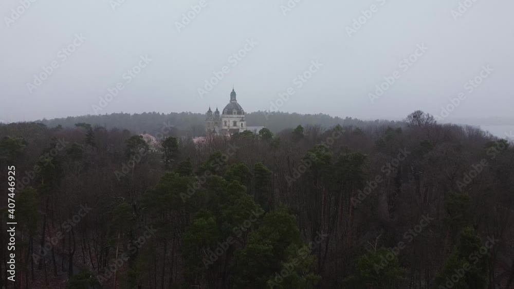 Drone landing in woods with Pazaislis Monastery complex in background Drone landing in woods with Pazaislis Monastery complex in background
