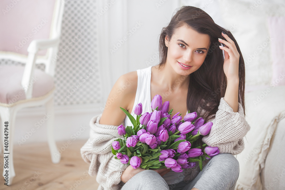 Closeup portrait og young very beautiful brunette woman with flowers Closeup portrait og young very beautiful brunette woman with flowers