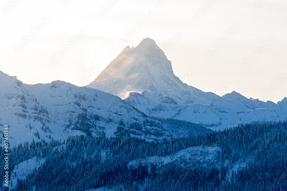 peak of Schreckhorn at sunrise in winter