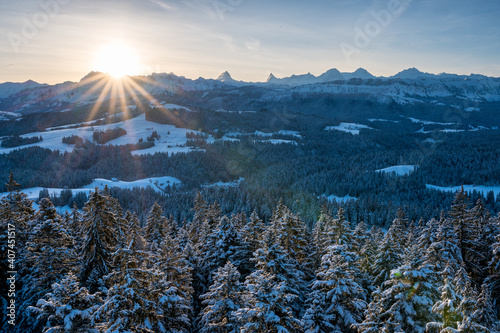 sunrise over the hills of Emmental and Bernese Alps in winter
