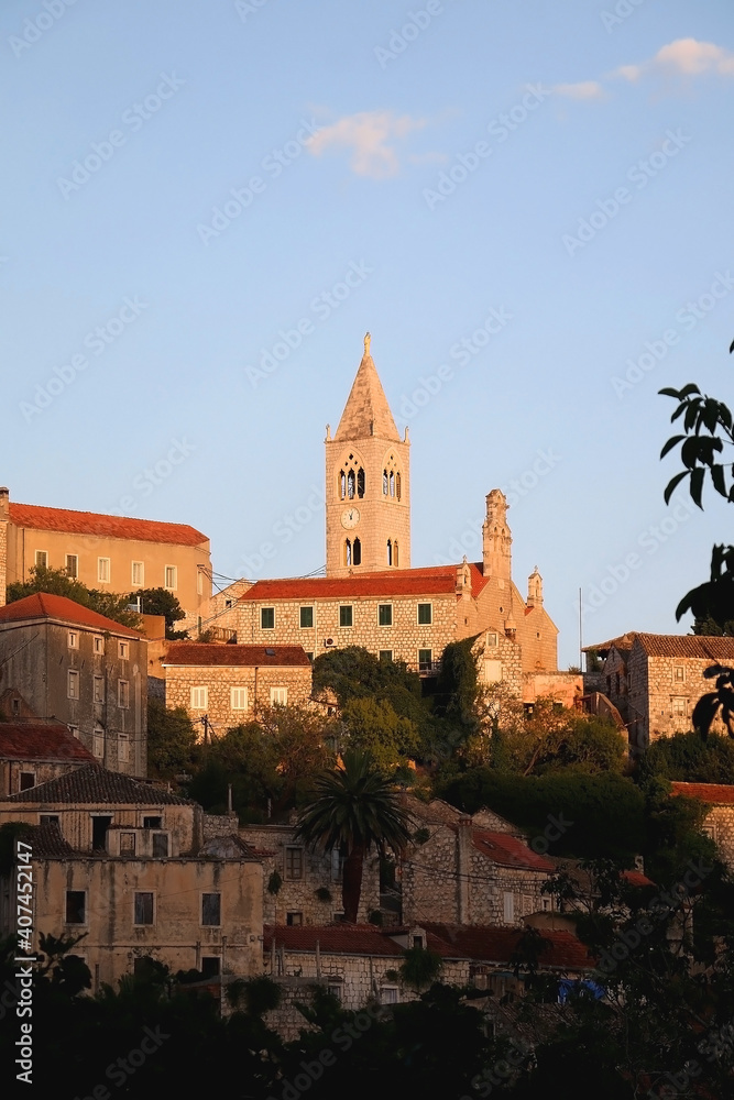 Sunset in Lastovo, small town on island Lastovo, Croatia. Traditional Mediterranean houses and historical church.