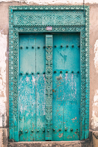 Blue-green door of a house in Stone Town, Zanzibar