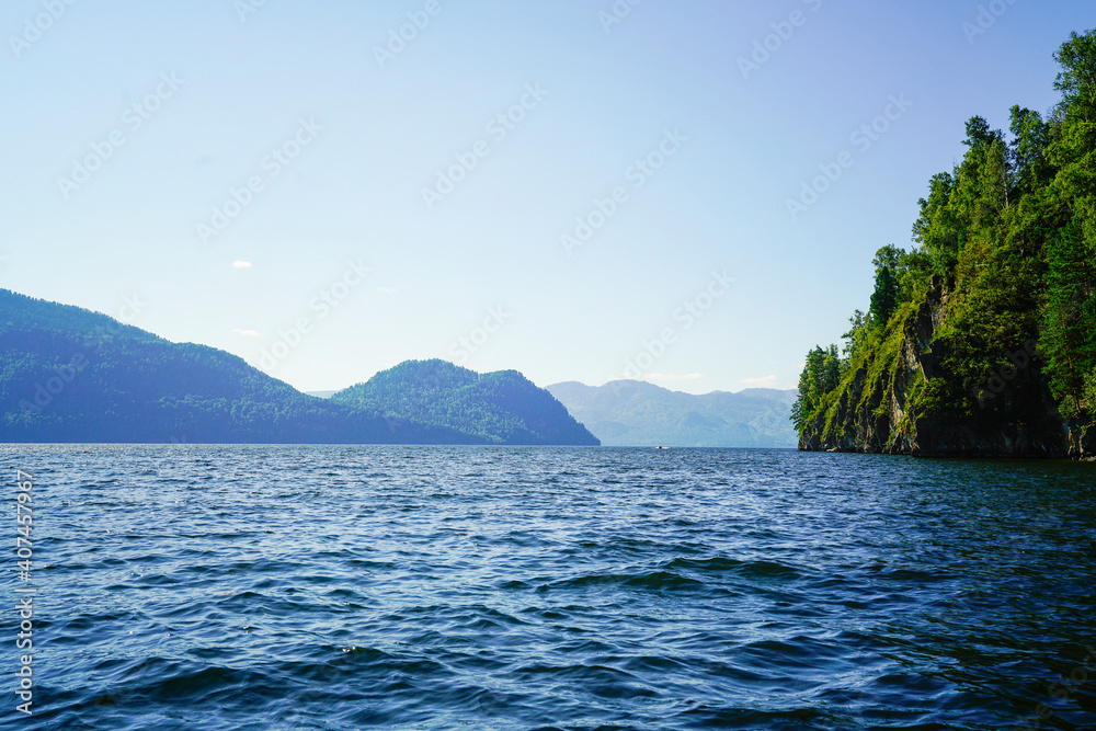 Troubled water of a large lake and mountains on the horizon Troubled water of a large lake and mountains on the horizon