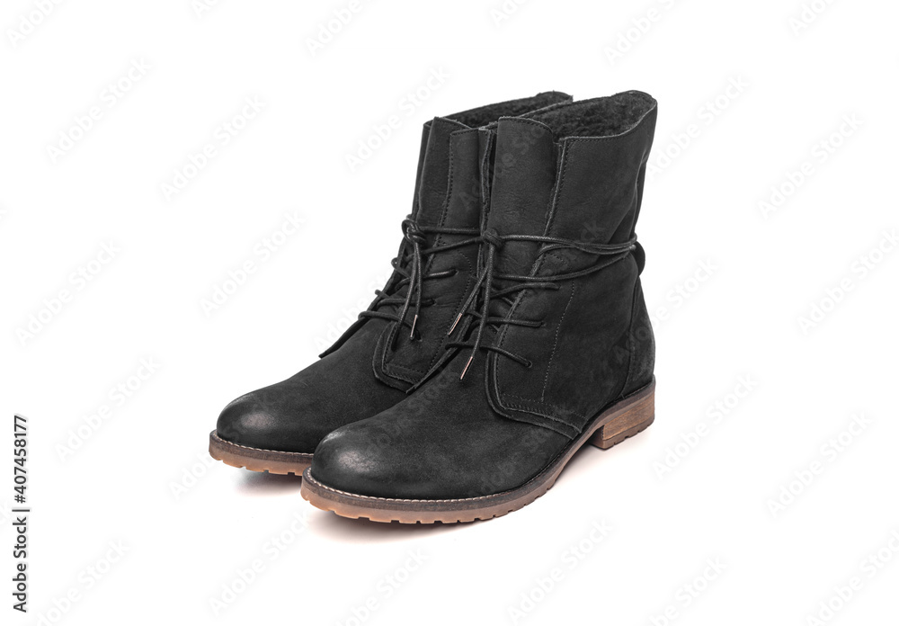 Black female winter boots isolated on a white background. Black female winter boots isolated on a white background.