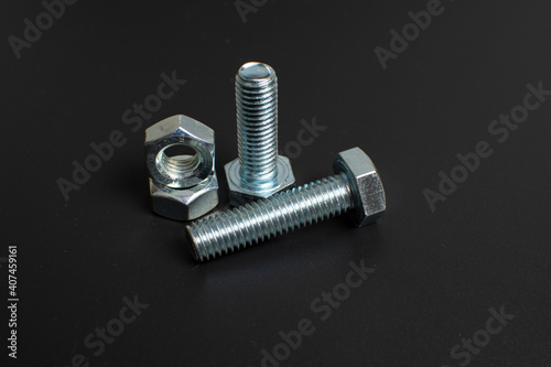 close-up of metal fasteners on black background