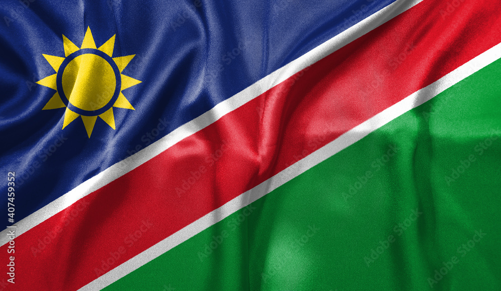 Obraz premium Namibia flag wave close up. Full page Namibia flying flag. Highly detailed realistic 3D rendering