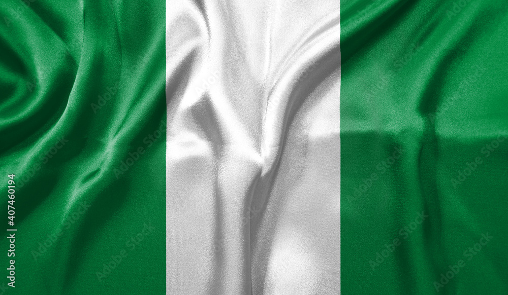 Nigeria flag wave close up. Full page Nigeria flying flag. Highly detailed realistic 3D rendering
