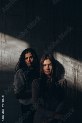 two woman in the shadow