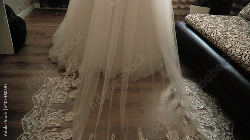 Part of the bride's white wedding dress