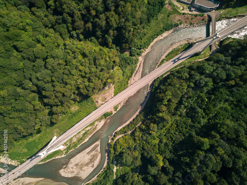 Aerial view panoramic suspension bridge over the river