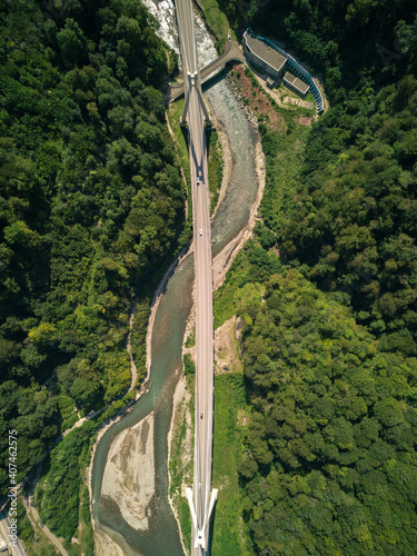 Aerial view panoramic suspension bridge over the river