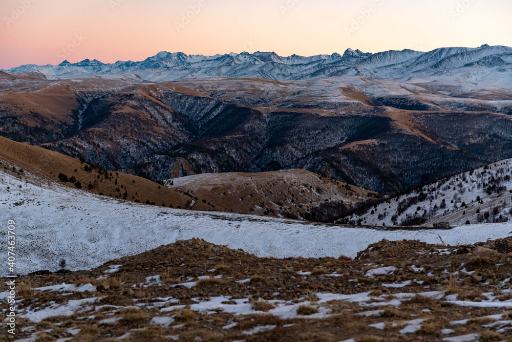 Mountain ranges at sunset in winter.