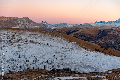 mountain plateau in the rays of sunset, beautiful gradient sky. Location Russia, Karachay-Cherkessia. Shajatmaz plateau