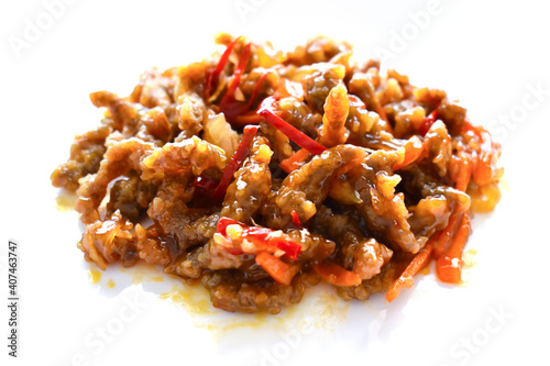 Crispy beef with sweet chilli sauce on white background. Traditional Chinese food. 