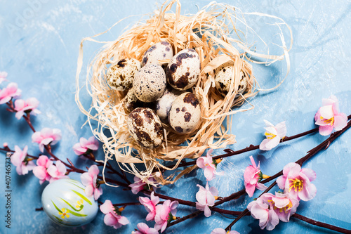 quail eggs inside nest in a easter background