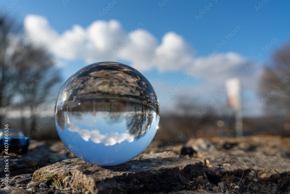 landscape seen through a gals ball. In the background the steam from a cooling tower landscape seen through a gals ball. In the background the steam from a cooling tower