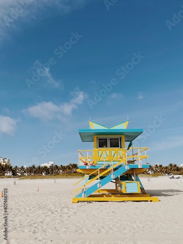Beautiful Yellow and light blue lifeguard tower under a cloudy sunny sky in Miami Beach. Southern Florida, USA © Maria